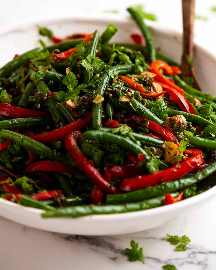 White serving dish with Yotam Ottolenghi's Green Bean Salad